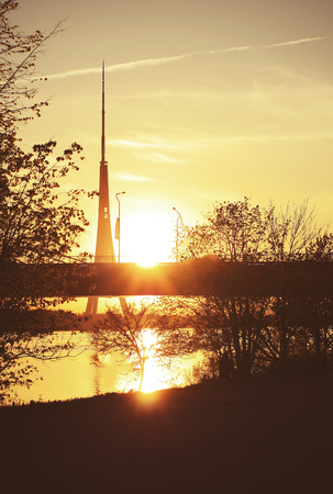 Evening landscape with bridge silhouette on sunset sky background. Riga, Latvia, East Europe.の写真素材