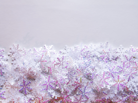 White artificial snowflakes on soft lightの写真素材