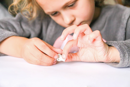 Child make figures from modeling clay. Creative activities in the process. Christmas and New Year...