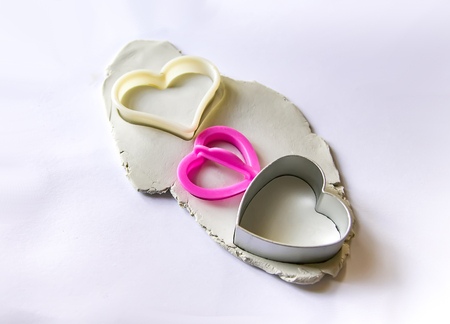 Figures creation from modeling clay. Creative activities in the process. Handmade decor for Valentine day.の写真素材