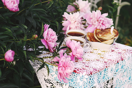 Tea in country style in summer garden in the village.の写真素材