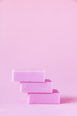 Handmade soap bars on soft pink background.の写真素材