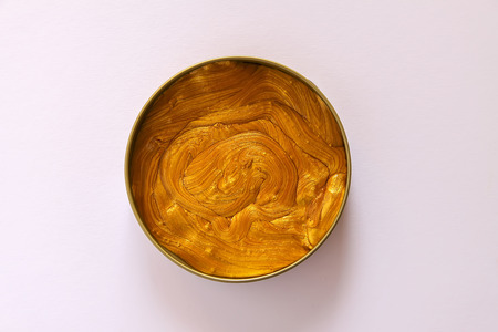 Golden plasticine soft stretchable texture. Anti-stress toy for kids activities, handmade, fun.