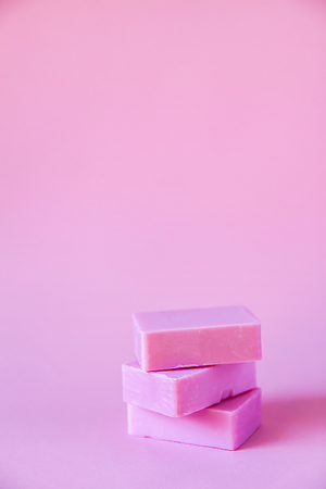 Handmade soap bars on soft pink background.の写真素材