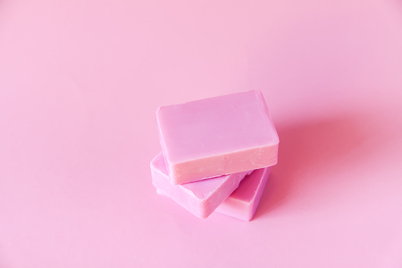 Handmade soap bars on soft pink background.の写真素材
