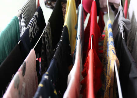 Drying colorful clothes on the laundry dryer indoors