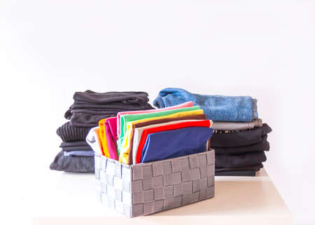 Folded colorful clothes in the box. Home organizing. Domestic vertical storage.の写真素材