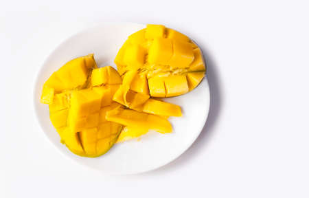 Fresh ripe mango sliced into cubes for the fruit pulp easily separating from the peel
