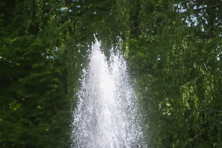 Beautiful waterfall in summer park.