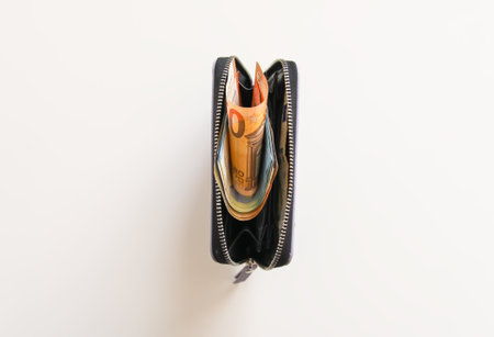 Euro money in the purple leather wallet. Banknotes close up.の写真素材