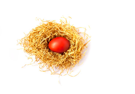Traditional Easter decor. Colorful eggs in the artifficial nest.の写真素材