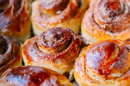 Freshly baked cinnamon buns. Sweet homemade pastry.の写真素材