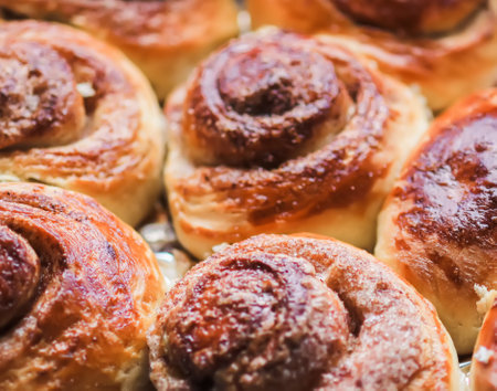 Freshly baked cinnamon buns. Sweet homemade pastry.の写真素材