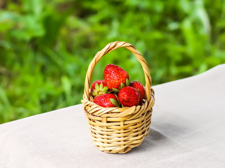 Ripe red strawberry in metal basket.の写真素材