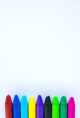 Colored crayons on paper background.の写真素材