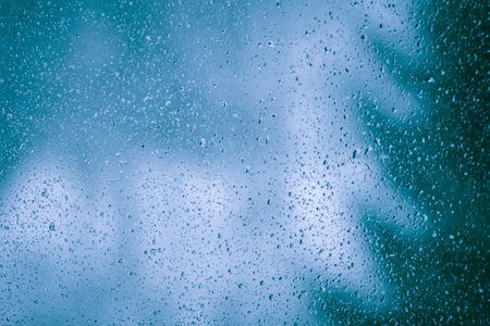 Misty window glass. Wet window background.