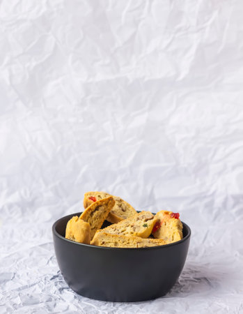 Homemade biscotti or cantuccini. Sweet gluten-free dessert in a black ceramic cup.の写真素材