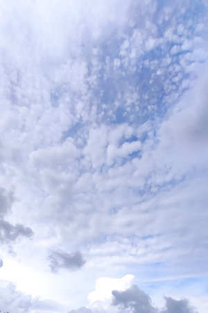 Sky with white clouds. Cloudy weather in summer day.の写真素材