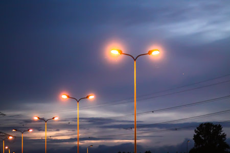 A row of street lights against the night sky.の写真素材