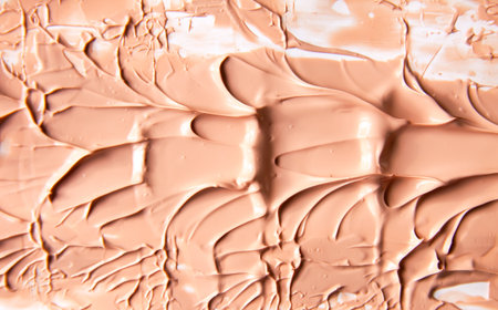 Abstract macro of smeared liquid cosmetic pigment. Clean and aesthetic background for beauty concepts.の写真素材