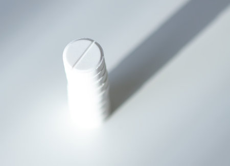 Various pills stacked on white background. Expresses clarity, vitality, and self-care.の写真素材