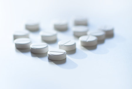 Vitamins and supplements on light backdrop. Conveys purity, health, and energy.の写真素材