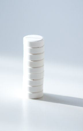 Stack of white pills. Clarity, vitality, and self-care.の写真素材