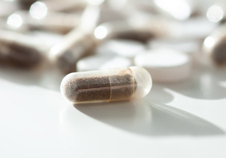 Macro shot of pills arranged neatly. Reflects daily health habits and modern medicine.の写真素材