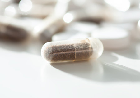 Close-up of multicolored supplements on pale background. Suggests vitality and self-care routine.の写真素材