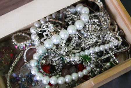 A pair of earrings lies neatly inside an elegant box. It highlights refined taste, celebration, and lasting sentiment.の写真素材