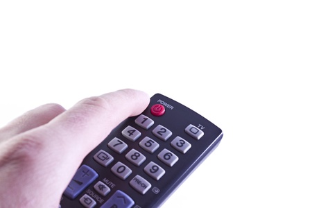 hand holding a TV remote controlの写真素材