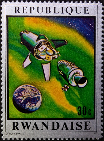 REPUBLIC RWANDA - CIRCA 1970: A stamp printed in Republic Rwanda commemorating the USA operation moon, circa 1970.のeditorial素材