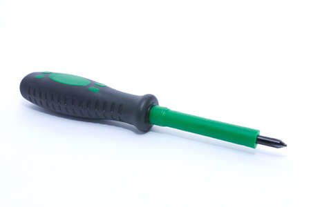 green and black screwdriver on white backgroundの写真素材