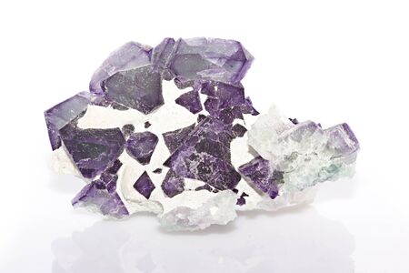 Fluorite crystal purple on white background の写真素材