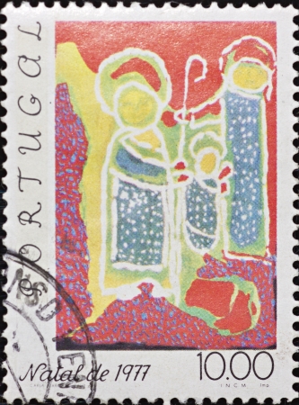 PORTUGAL - CIRCA 1977: A stamp printed in Portugal,shows an image celebrating Christmas,circa 1977.のeditorial素材