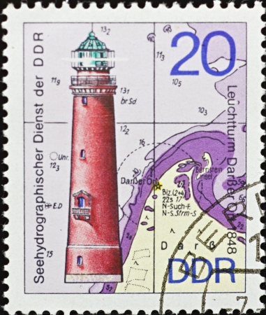 GERMAN DEMOCRATIC REPUBLIC - CIRCA 1974: A stamp printed in Germany,shows a picture of a lighthouse at sea,circa 1974.のeditorial素材