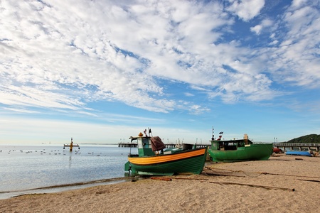 Old fishing boats at the beach in Orlowo, Poland.の写真素材