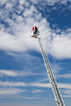 Ladder extended on a fire truck.