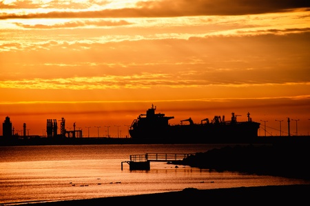 Tanker ship on the background of the rising sun. の写真素材