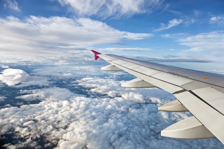 The view from the airplane at the clouds in the sky の写真素材