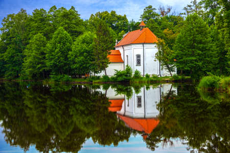 Old church with reflections in the water の写真素材
