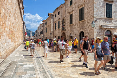 Tourists walking on the most popular street - Stradun, old town of Dubrovnik, Croatia.のeditorial素材