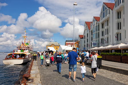Lot of Tourists walking, shopping and sightseeing at Old Town, on July 20, 2011 in Stavanger, Norway.のeditorial素材