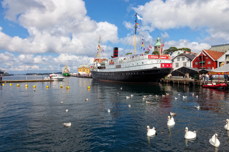 Lot of Tourists walking, shopping and sightseeing at Old Town wharf, on July 20, 2011 in Stavanger, Norway.のeditorial素材