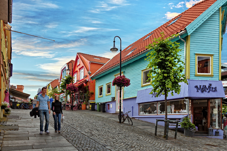 Unidentified people walking on the sidewalk of a shopping street in Stavanger, Norway.のeditorial素材