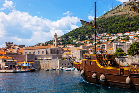 A view across the marina, at boats anchored in the harbor and the hillside surrounding the marina at Dubrovnik, Croatia.のeditorial素材