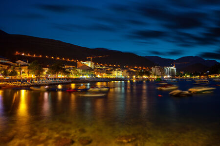 Beautiful night landscape of seaside town of Petrovac, Montenegro.の写真素材