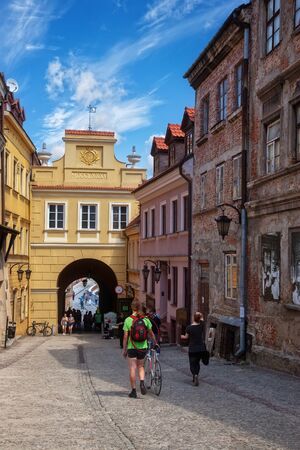 Tourists and residents walking on street in the Old Town in a sunny day, on May 11, 2013 in Lublin, Poland.のeditorial素材