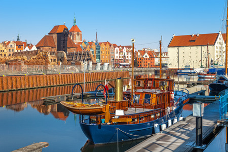 View of the riverside on Old Town by the Motlawa river in early morning light. Gdansk, Poland.