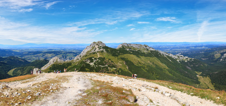 The group of hikers walking on top of peak on August 20 2012 in the Tatra National Park Poland.のeditorial素材